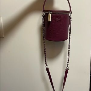 Brand new Lacoste purse never worn before, received as gift.